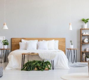 Calm colour pallet bedroom with double bed in centre of the room.