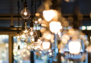 Retro light bulbs hanging from the ceiling on long cables