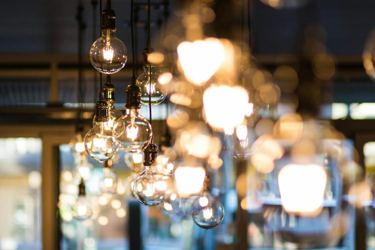 Retro light bulbs hanging from the ceiling on long cables