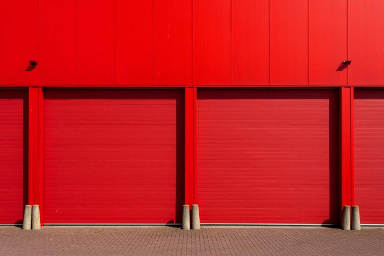 Red garage doors to storage area