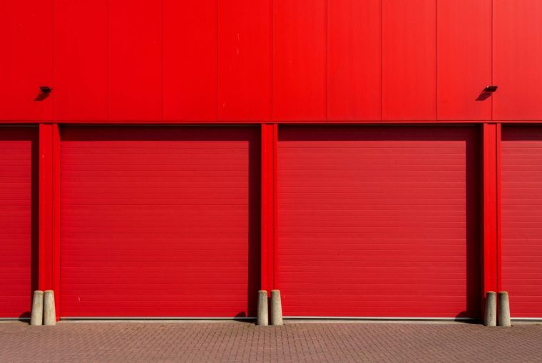 Red garage doors to storage area