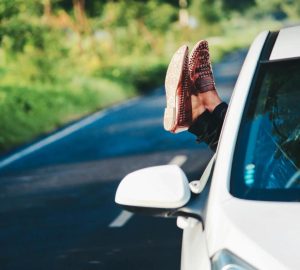 White care with feet hanging out of the window