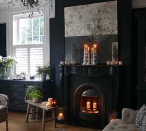 Dark painted living room with black period fire surround