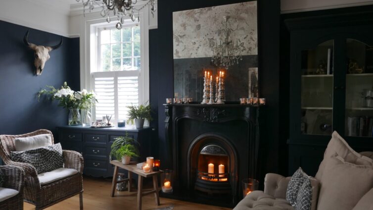 Dark painted living room with black period fire surround