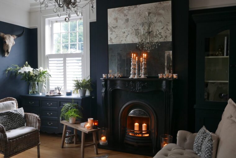 Dark painted living room with black period fire surround