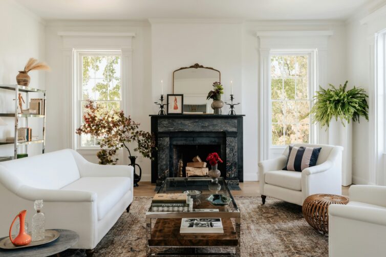 Lounge with white sofa and black fire surround
